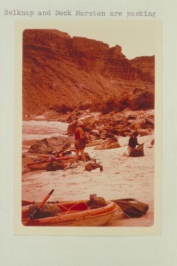 Up river at camp at head of Rapid No. 13. The knob on the skyline is below the mouth of the side canyon at Mile 205.7. Bill Belknap and Dock Marston are packing