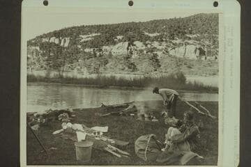 First camp on the Dolores River. Margaret Marston watches Becky Walker