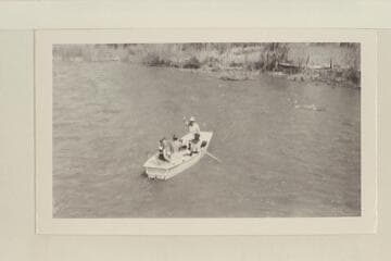 The start of the boat trip down the Dolores River. Dolores, Colorado. Left to right, boat in stream: Becky Walker, Pres Walker at the oars, Marston and Margaret Marston