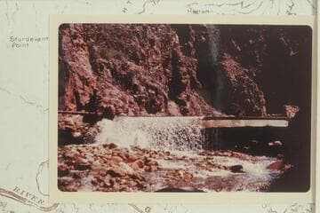One of four aluminum trail bridges in Bright Angel Creek after being wrecked by the flood of 1966, Dec. 06. In The Box