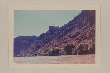 Butte on left bank of Colorado River at approximately Mile 215. Appears in distance in 5610 CTCN 212.9.3. Appears in Best Expedition photo. 917 BTEN 15