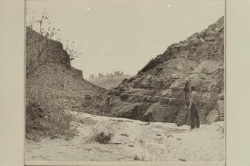 Kent Frost at the first drop into Red Lake Canyon or Butler Canyon. The Land of the Standing Rocks across the Colorado in background