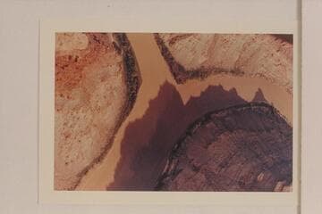 Junction of the Green and Colorado Rivers. The Green enters from the left. The Colorado comes from the top of the print. Approximate gauge: 30,000 cfs.?