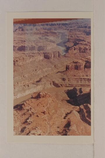 The Colorado River in the area of The Loop. The low nect at lower left is Mile 5. The side canyon at lower right is Mile 5.3. The other side of the next is Mile 8. The saddle at upper right is between Miles 7.1 and 11.3