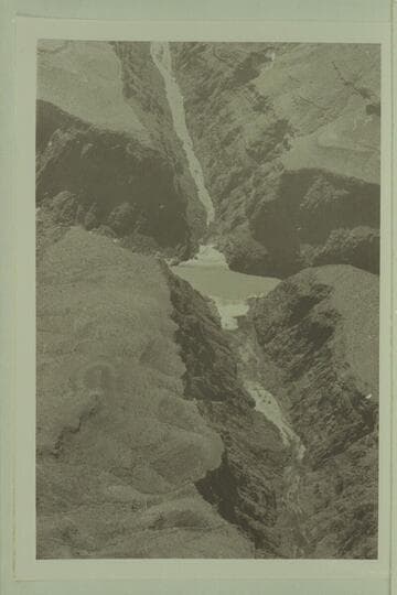 Looking southwest to mouth of Separation Canyon and Colorado River. The beach on the far side of the river is the campsite of the Powell party of 1869, Aug