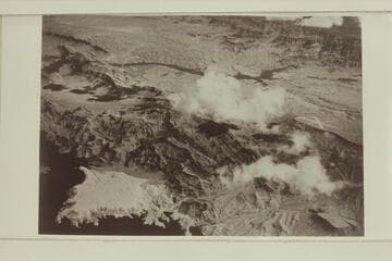 The Colorado River is upper center and flowing from right to left.The Grand Wash Cliffs are upper right. Below them, Grapevine Wash enters from the right. The air strips are above Pierces Ferry. Sand Point is lower left.Lake Mead is partially filled