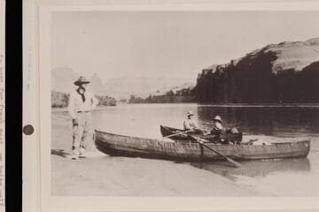 George C. Fraser, Dave Rust, Sarah Fraser in Dave Rust's canvas folding boats at camp near Hole-in-the-Rock. Mile 84; Glen Canyon