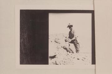 Sampling strata above Lees Ferry camp. Helper to Ernest Wander, the Assayer