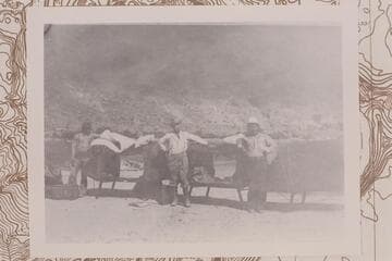 Cots at Lees Ferry brought in by Parkyn, Lovett, and Daniels. Tom Lovett is center between Navajos. Copy of print #15 in Waller collection
