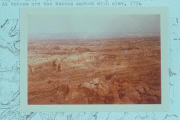 Westerly across Stevens Canyon from approximately two miles below the Garfield and Kane Counties boudary. At bottom are the buttes marked with elevation 5754