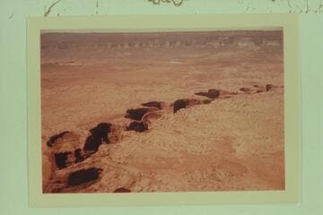 Up Coyote Gulch from near its mouth. The Straight Cliffs and Fifty Mile Mountain at top