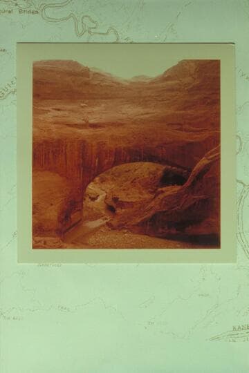 Gregory Natural Bridge, Soda Gulch, Escalante River; downstream view. Figure on ledge to right of stream is Kent Frost