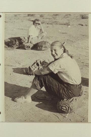 Zoe Desloge at Pierces Ferry, end of 1947 Grand Canyon traverse. Marie Saalfrank sits in the background