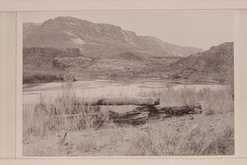 Cable anchorage at Lees Ferry. The buildings of the Spencer Mining operation and the fort are right center