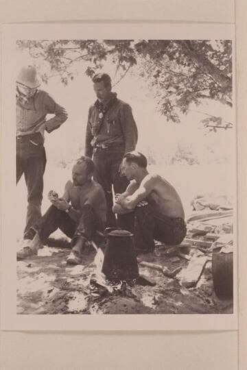 Charles Larabee standing; Buzz Holmstrom and Norm Nevills seated. Pats Hole