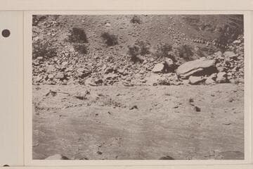 The "Dellenbaugh" running Hance Rapid, Mile 76. Parley Galloway is at the oars and Eddy rides as passenger