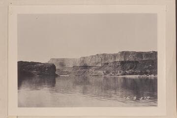 Lower end of Glen Canyon showing Vermillion Cliffs in background. At Lees Ferry. The cliffs in the background are the Vermillion Cliffs of the Paria Plateau