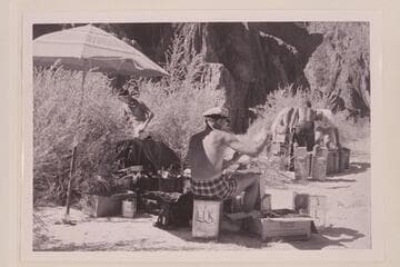 Brian checks the groceries. Fueling in the background. Beach at Bright Angel Creek