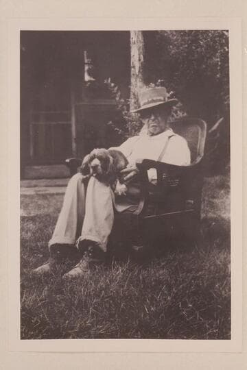 Doc Inglesby in chair used by Julius Stone in Glen Canyon trip of 1938. The dog is "Judy."