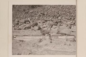 Hugh Cutler at the oars of the "Mexican Hat II" in Dubendorff Rapid. Hugh appears to be using the oars for braking speed