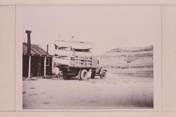 The three Nevills' sadirons on truck ready to start for Green River, Wyoming. In front of Nevills' residence at Mexican Hat