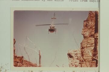 Helicopter leaving Royal Arch Creek carrying the injured Harvey Butchart. North of Royal Arch Creek
