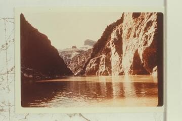 Upriver from near mouth of Sapphire Canyon. The small butte at left is Scylla Butte and Geike Peak towers above it. From near the stop for lunch