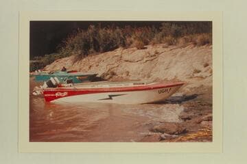 The "Ugh" and the "Ben Hurt" tied at the lower end of Vulcan Rapid at the left bank. The record suggests that these two boats made no effort to run up the rapid