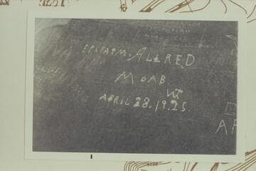 Inscription in cave of White Rim Formation at lower end of Beaver Bottom