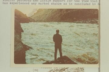 Brick Mortenson sizes up the patterns in Vulcan Rapid. Brick and David Mortenson et al hiked to the river