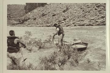 Jack and Walt lining around Government Rapid. The "Black Submarine" was lined but Don Wimpress ran the rapid in the "Argo."