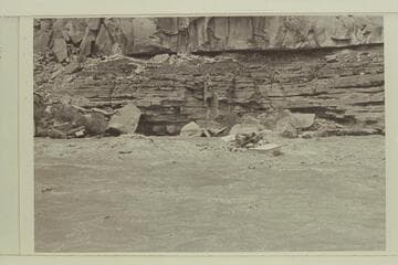 Running Syncline Rapid- San Juan River. Evie Mull on stern, Nevills as boatman and Liz Fox at bow