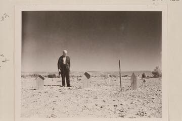 Graves of Galloway and his wife at Vernal cemetery. Marston stands at grave