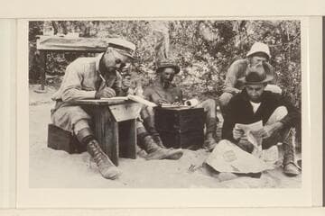 In camp at Diamond Creek. Left to right: Moore, LaRue, Stabler, Roger Birdseye. Boots and breeches worn by Moore are a major hazard