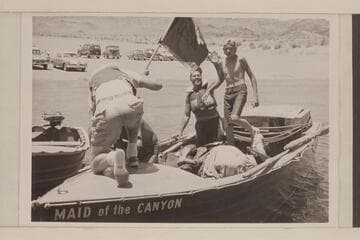 Arrival of "Maid of the Canyon" at Boulder City dock. Roy Bolton and Jeff Marston at the stern