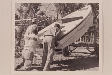 AK Reynolds, Lug Larsen and George Reynolds unloading the "Galloway" at Carrs Landing
