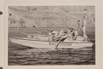 The Clover-Nevills party lined up for photographers on Lake Mead after completing Grand Canyon traverse of 1938. Emery Kolb stands on the deck of the "Wen."