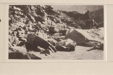 "Glen" and "Boulder" waiting their turn for launching and loading at Lava Cliff Rapids. The escarpment of lava is above and to the right
