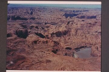 Mouth of Aztec Creek. The canyon of Toh Dilth Ylth is right of center. Crack at upper right is at 73. Approximate gauge: 31,000 cfs