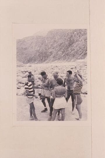 Puzzles at Diamond Creek camp of the 1948 Nevills party. Wright in distance, Nevills, Doerr, Masland, Nancy Streator, Garth Marston and Rosalind Johnson