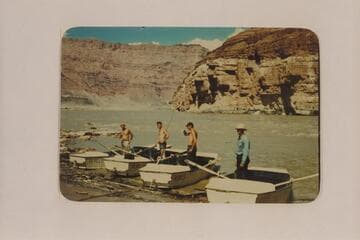 Four boatmen of Nevills San Juan party landing below Paria Riffle at end of run on San Juan River: Nevills, Wing, Reilly and Wright