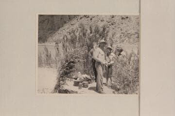 The crew of the "Esmeralda II" trying to force down some of the paste breakfast at camp in lower Grand Canyon: Edward Hudson, Robinson, Marston and Taylor
