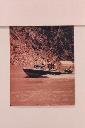 The "RATTLESNAKE" cruising in the Grand Canyon between Whitmore Wash and Lake Mead. Rod Sanderson is piloting, in back of him sits Joe Desloge, Lois Sanderson and Hugh Cutler