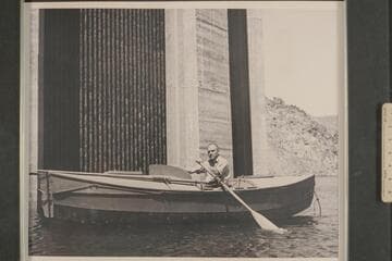 Buzz Holmstrom in his skiff, the "Julius F" after the end of the 1938 run from Wyoming to Lake Mead. He was permitted to row down to the face of Hoover Dam for the publicity possibilities