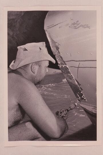 Bill Belknap drills holes for the patching of the "CACTUS" at Tuna Creek Rapid, just above Esmeralda Bend, Grand Canyon