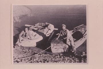 Amos Burg on the rubber raft and Holmstrom on his boat "Julius." The "Julius" was named for Julius F. Stone, who sent Holmstrom $500 to aid in the expenses of the trip. Lake Mead