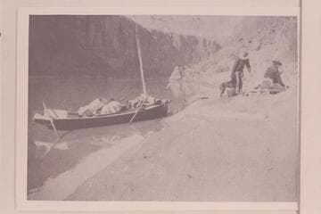 Galloway and Knox at camp in Glen Canyon. The boat was borrowed from the Hoskaninni Mining Company near Hite and used for the run to Lees Ferry. After reaching Lees Ferry on Thanksgiving, the trio walked to Flagstaff