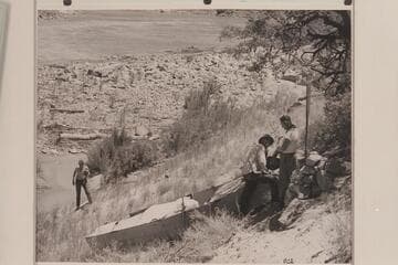 Loper's wrecked boat near Mile 41 in Marble Canyon. Edward Hudson at left; Ed Hudson and Willie Taylor at right