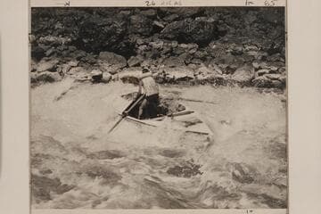 Kent Frost beam-on in Buck Creek Rapid, Hell's Canyon, Snake River. Note he has dropped the oars in accord with Nevills' idea of handling a boat in rough water