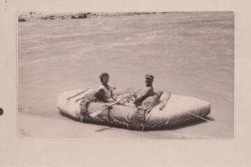 Fern and Bill Davis in 11 1/2-ft. canvas-covered neoprene raft. About 10 min. downriver from Rapid 22, Cataract Canyon